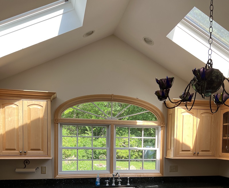 Vinyl interior specialty elliptical and double hung window